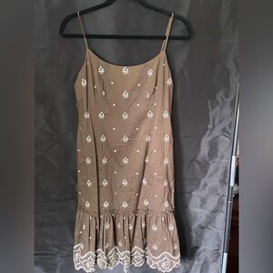 Ann Taylor brown, lined dress. I’m 5’4 and it is above the knee. Washable.